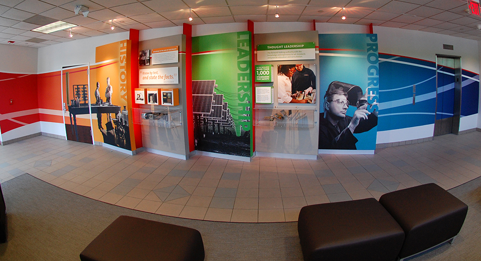 Corporate interior fitted with printed display panels and wall graphics.