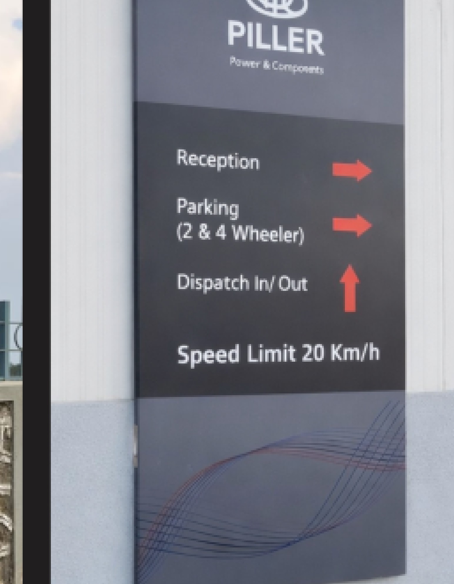 Directional wayfinding markers guiding movement across an industrial plant.